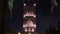 Night view on Hassan tower from the square with lanterns and Flags in Rabat, Morocco. Unfinished mosque minaret