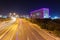 Night view of highway with neon cube