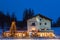 Night view of house with lighting Christmas tree in front