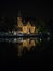 Night view of illuminated Kasteel Minnewater castle in Bruges canals historical city center world heritage Belgium