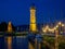 Night view of illuminated New Lindauer Lighthouse at harbor of Lindau at lake Bodensee in Germany