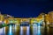 Night view of the illuminated Ponte vecchio in the italian city florence...IMAGE