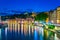 Night view of illuminated riverside of Saone river in Lyon, France