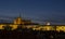 Night view of illuminated St. Vitus Cathedral gothic churche and Prague Castle panorama with hradcany, dark blue sky.