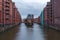 Night View of Illuminating Speicherstadt Warehouses along the Canal, Hamburg, Germany