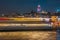 Night view of Istanbul cityscape Galata Tower with floating tourist boats in Bosphorus ,Istanbul Turkey