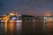 Night view of Istanbul cityscape Suleymaniye Mosque Rustem Pasha Mosque with floating tourist boats in Bosphorus ,Istanbul