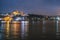 Night view of Istanbul cityscape Suleymaniye Mosque Rustem Pasha Mosque with floating tourist boats in Bosphorus ,Istanbul