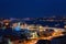 Night view of Istanbul, scenic cityscape with buildings in lights, bridge, bay and blue sky with full moon, Turkey