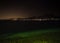 Night view of Lake Garda and the illuminated villages on the west coast.