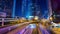 Night view of modern city traffic across street. Time lapse. Hong Kong