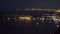 Night view of Monaco harbor, venue for international yacht shows, aerial shot