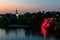 Night view of Monastyrsky Island with illuminated artificial waterfall `Roaring Threshold` and small church of Saint Nicholas