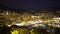 Night view of Monte Carlo in Monaco, illuminated houses and yachts in harbor