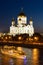 Night view of Moscow Christ the Savior Cathedral, Moskva river with pleasure boat and embankment from Bolshoy Kamenny Bridge