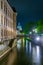Night view of the new town hall in Hannover behind Leine creek, Germany