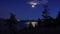 Night view of Okanagan Lake near Peachland British Columbia Canada in the moon light with many forest fires burning in the backgro