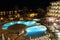 Night view over hotel and pool