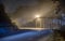 The night view of the pass road is full of fog with magical street lights