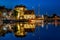 Night view of the picturesque harbour of Honfleur, yachts and old houses. France, Normandy, Europe.