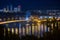 Night view of Podil and Obolon districts of Kyiv and Dnipro River Dnieper with various bridges. Ukraine, July 2020