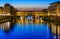 Night view of Ponte Vecchio over Arno River in Florence
