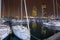 Night view of Port Olimpic harbor and marina in Olympic village in Barcelona. Mooring yachts, boats and other