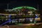 Night view of The Riverbank Precinct Pedestrian Bridge and oval football stadium in Adelaide