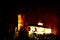 Night view of RoÅ¾mberk chateau towering on a rock above the Vltava river