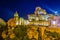 Night view of rooftops of the Italian city Matera with san pietro caveoso and madonna de Idris churches...IMAGE