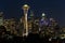 Night view of the Seattle skyline with the Space Needle and other iconic buildings in the background.