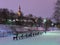 Night view of a snow covered park with bare trees outside the medieval city walls of Tallinn
