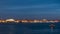 Night view of spit of Vasilyevsky Island and opened Birzhevoy Bridge with rostral column timelapse, Saint Petersburg
