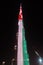 Night view to Burj Khalifa skyscraper in Dubai flag of UAE, UAE