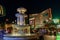 Night view of Venetian hotel fountain and Treasure Island hotel building