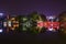 Night view with water reflection of The Huc Bridge in bright red with Ngoc Son Temple, Hanoi, Vietnam.