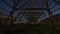 Night view of wooden drying racks used for preservation of traditional stockfish with stars on the blue sky in harbor of Svolvaer.