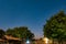 Night view of wooden shacks under the sky