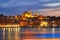 Night view at Yeni Cami Mosque worship place from Galata bridge reflected in water of Golden Horn of Bosporus