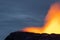 Night volcanic eruption. Fresh hot lava, flames and poisonous gases going out from the crater