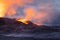 Night volcanic eruption. Fresh hot lava, flames and poisonous gases going out from the crater