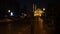 Night walk to Al Noor Mosque in Sharjah. The avenue is lit by lanterns. Building of the mosque is illuminated with