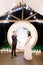 Night wedding ceremony outdoors. Bride and groom swear an oath each other on wedding arch background. Beautiful just