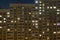 Night windows of a high-rise building in the big city