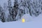 Night winter mountain landscapes. Igloo stands on the snowy lawn. House with light. Location place the Carpathian mountain.