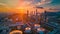 Nightfall over Urban Oil Refinery with City Skyline Silhouette and Dramatic Sunset Glow