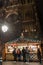 Nightime view of many people visiting the famous Christmas market in Strasbourg with the cathedral in the background