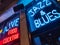 Nightlife in Chicago with Jazz and Blues music. Retro bar with blue and red neon sign