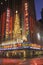 Nightlights and red reflection of Radio City Music Hall in Manhattan, NY with Christmas lights