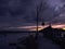 Nightscape over the commercial dock with moored boat at moody twilight